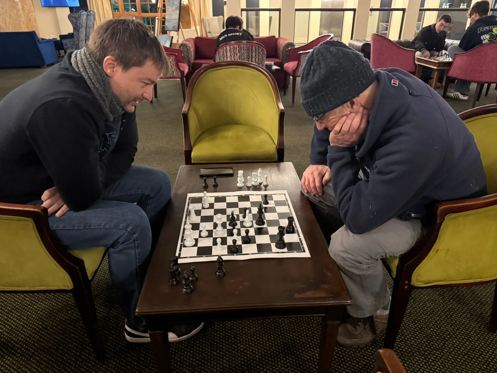 Players engaged in a chess game during a club night.